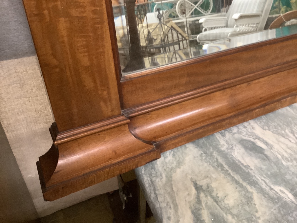 An early 20th century mahogany overmantel mirror, width 144cm, height 77cm